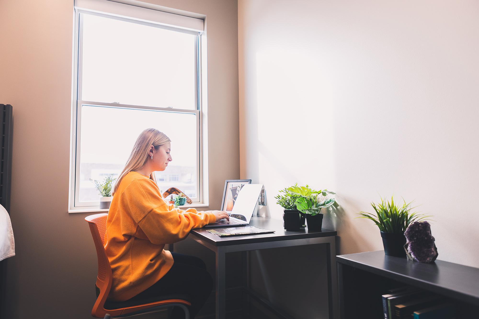 A Doane student studying in Doane Hall.